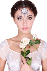 Naklejka premium Portrait of the beautiful young girl in an image of the bride with ornament in hair. Youth and Skin Care Concept. isolated on white background