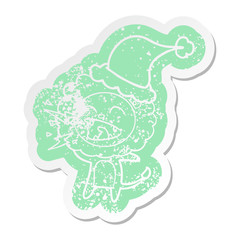 cartoon distressed sticker of a roaring lion wearing santa hat