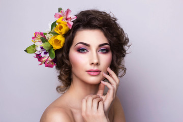 Obraz na płótnie Canvas Beautiful Girl with Spring Flowers. Fresh skin