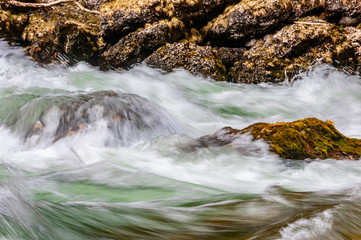 river with rock and soft water