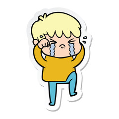 sticker of a cartoon boy crying