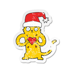 retro distressed sticker of a cartoon cat loving christmas