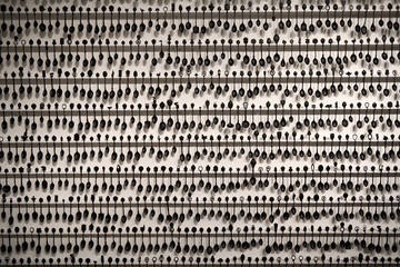 Art installation of 2000 spray painted souvenir spoons on a white wall by black artist Chantal...