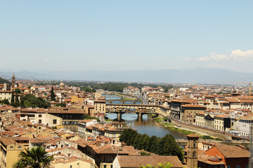 Fototapeta na wymiar orange roofs and river Florence top view