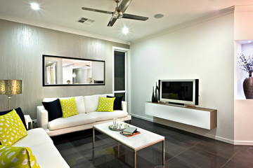 Living room area close up with a mirror and television