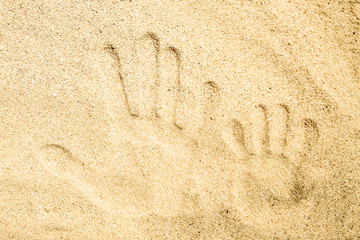 Beautiful drawing on the sand of the sea background