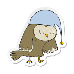 sticker of a cartoon owl sleeping