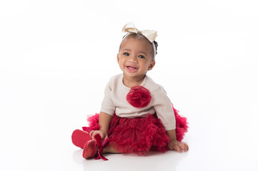 Smiling Baby Girl Wearing a Red Tutu