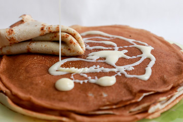 stack of pancakes with condensed milk