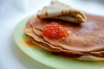 stack of pancakes with red caviar