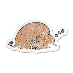 distressed sticker of a cartoon mammoth sleeping