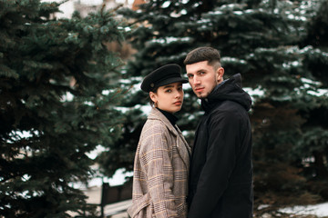 Young couple of pretty cute girl and bearded guy
