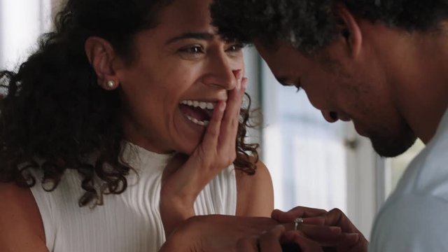 happy couple marriage proposal young man proposing to woman hugging partner enjoying romantic surprise engagement