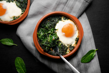 Meal with baked spinach and eggs.