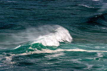 big ocean waves in windsy weather