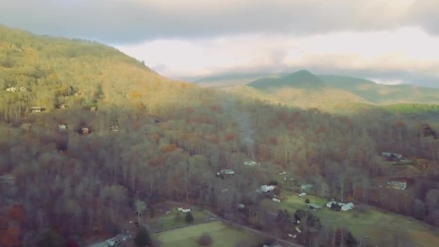 206 Aerial Mountain with houses Autumn panning