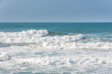 big ocean waves in windsy weather