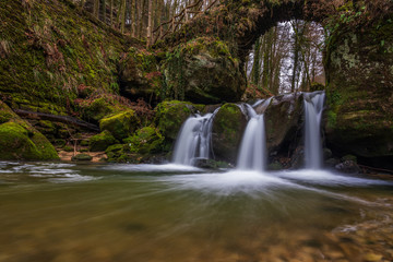 The Schiessentümpel is a small and picturesque waterfall on the Black Ernz river. Mullerthal - Luxembourg’s Little Switzerland.