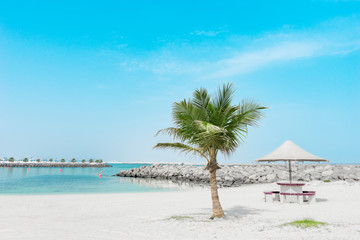 White sandy beach with blue lagoon and a place for contemplation. Al Mamzar, Dubai, Emirates, Jul.2018