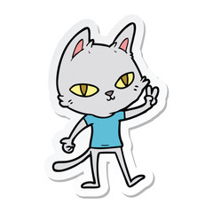sticker of a cartoon cat waving