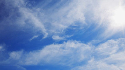 Naklejka na ściany i meble Beautiful blue sky with white clouds. Nature abstract background.