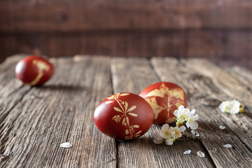 Easter eggs dyed with onion peels, with a pattern of fresh herbs