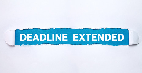 Deadline Extended text on torn paper.