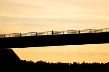 Fototapeta na wymiar man on a bridge silhouette