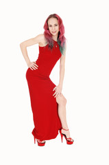 Young woman in red dress and hair bending forwards
