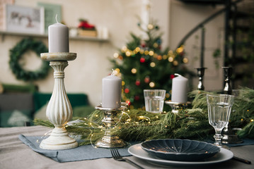 A beautiful served table with a large burn with a beautiful flour and candles