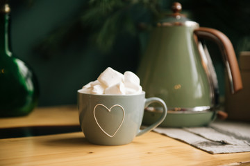 beautiful light cup with a heart and cubes of sugar, a pleasant pastime