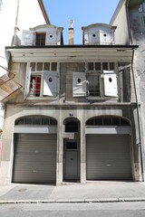 Fototapeta na wymiar Switzerland, Geneva - 06 20 2018: Old living house facade. Geneva, Switzerland