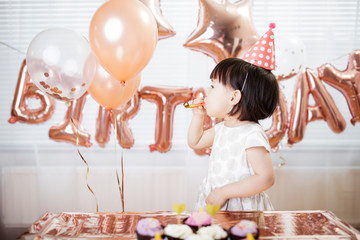 toddler girl celebrating her third birthday at home