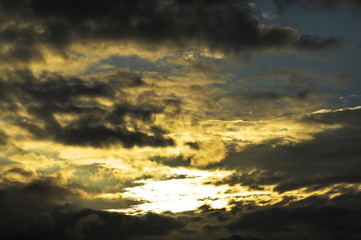 Dark clouds in a sunny sky