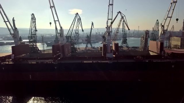 Cranes loadin ship. Side view