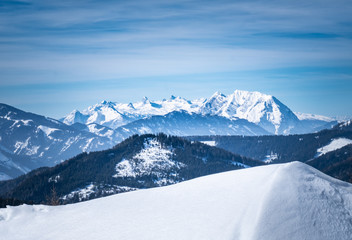 View from snowy plateau Kaiserau to mountain Dachstein on winterday