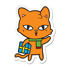 sticker of a cartoon cat with a present