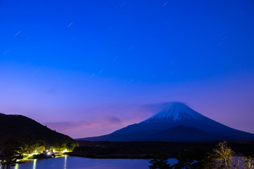 Mount Fuji at twilight after sunset, the World Heritage, view at Lake Shoji ( Shojiko ). Fuji Five Lake region, Minamitsuru District, Yamanashi prefecture, Japan. Landscape for travel destination.