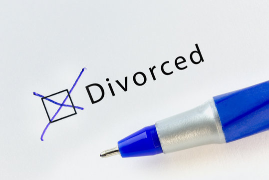 Divorced - checkbox with a cross on white paper with blue pen. Checklist concept