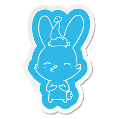 curious bunny cartoon  sticker of a wearing santa hat