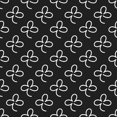 Seamless pattern with line signs of shamrocks.