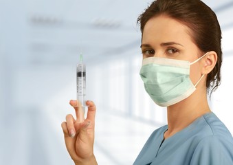 Young female scientist standing in her lab.