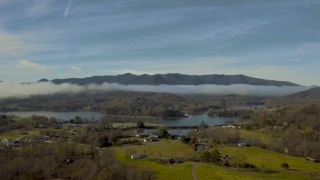 208 Georgia mountain town with lake flying in aerial 