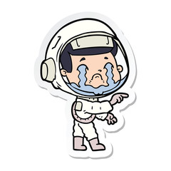 sticker of a cartoon crying astronaut