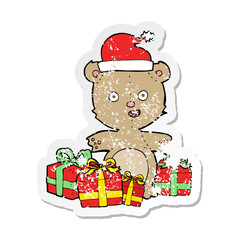 retro distressed sticker of a cartoon christmas teddy bear