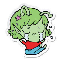 sticker of a cartoon crying alien girl