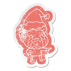 cartoon distressed sticker of a man crying wearing santa hat