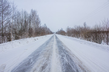 Fototapeta na wymiar Snowy winter road. The road is covered up. Russian dear. Winter fairy tale