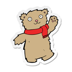 sticker of a cartoon teddy bear wearing scarf