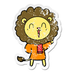 distressed sticker of a laughing lion cartoon in winter clothes